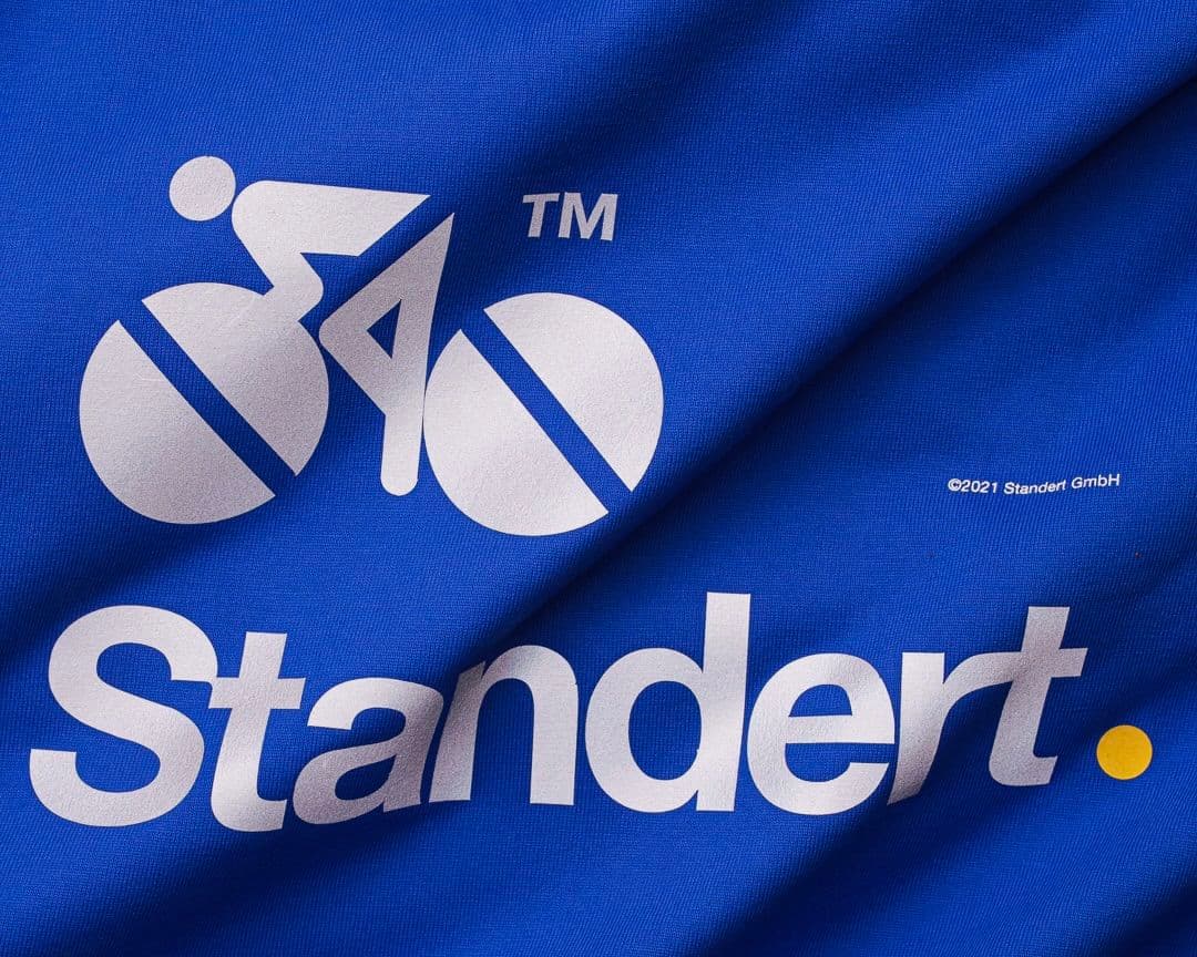 Blue fabric with a white cyclist logo and the text "Standert." and "©2021 Standert GmbH" printed on it.