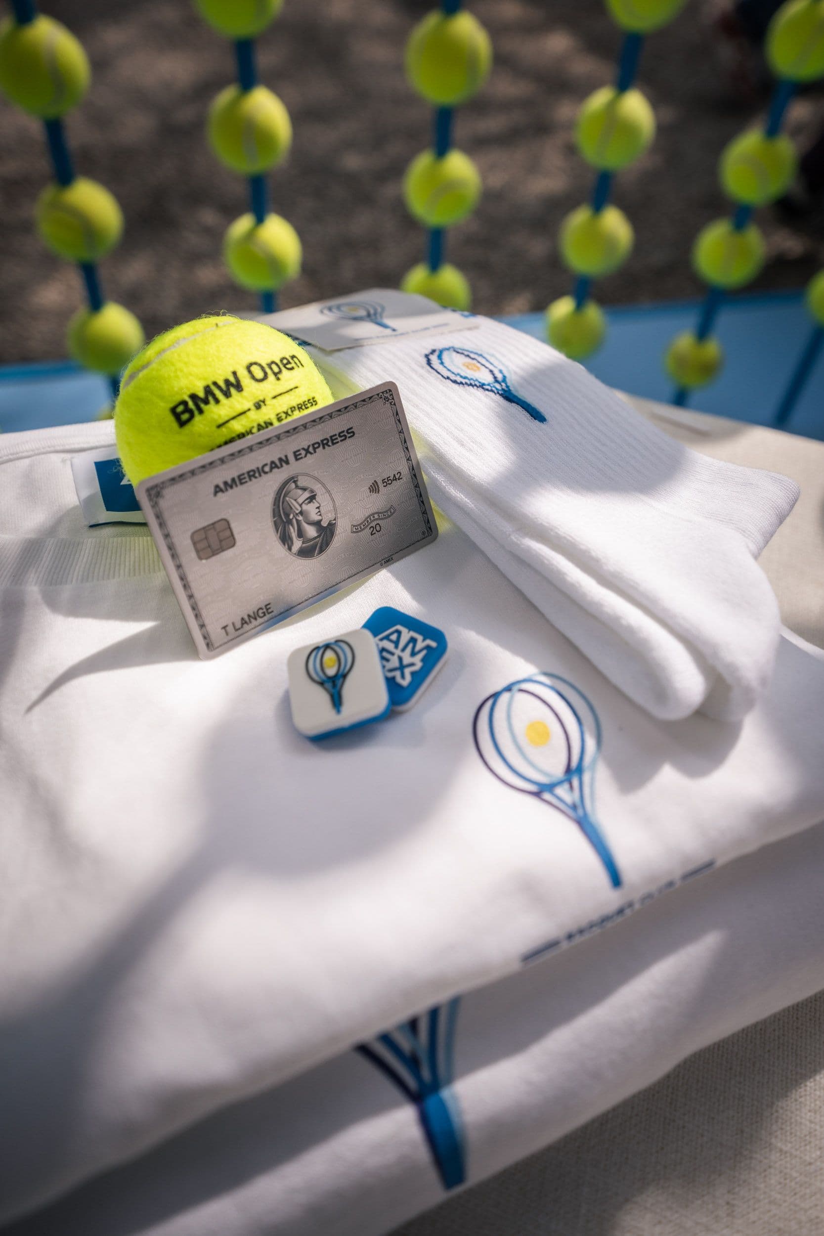 American Express BMW Open custom sweatshirt with branded tennis ball and socks.