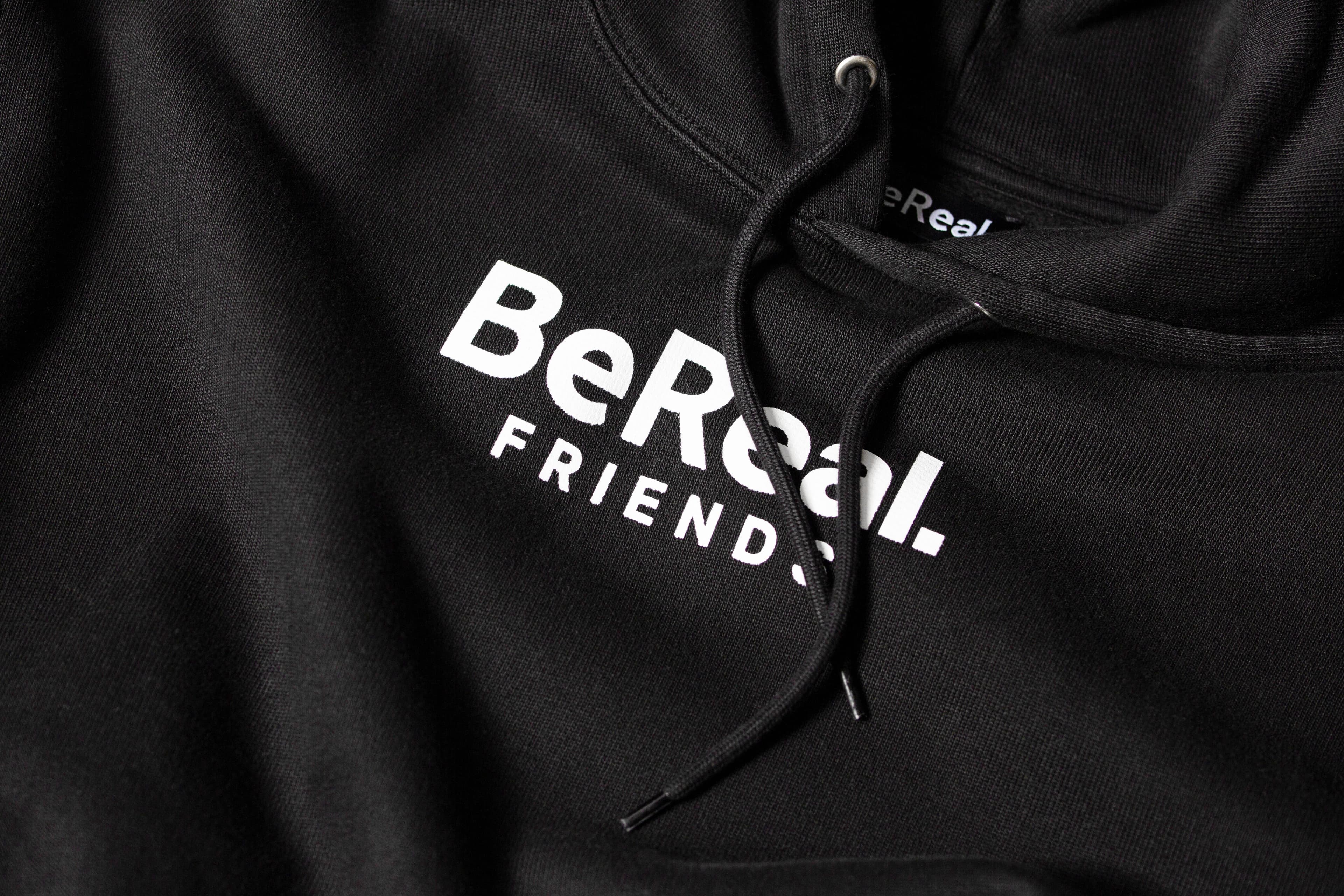 Black hoodie featuring the BeReal Friends logo printed in white.